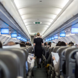 a flight attendant checking the airplane for departure